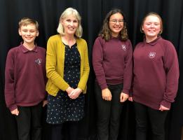 The winning team from Sheringham HS and their English teacher